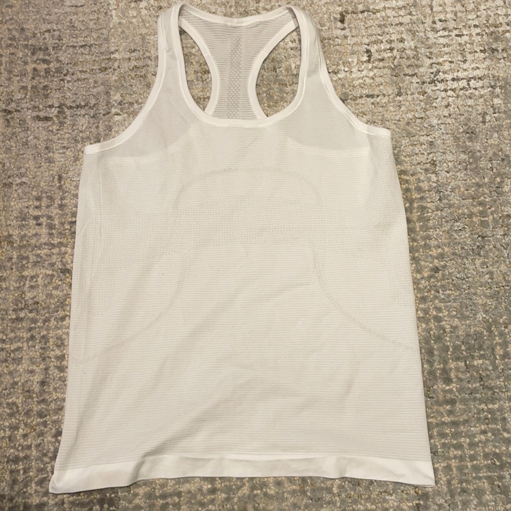 Never worn. Swiftly tech racer back
